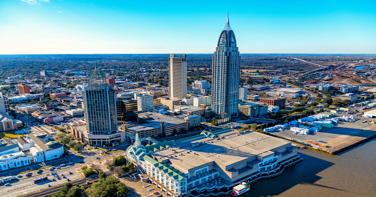 a group of lawn chairs sitting on top of a beach