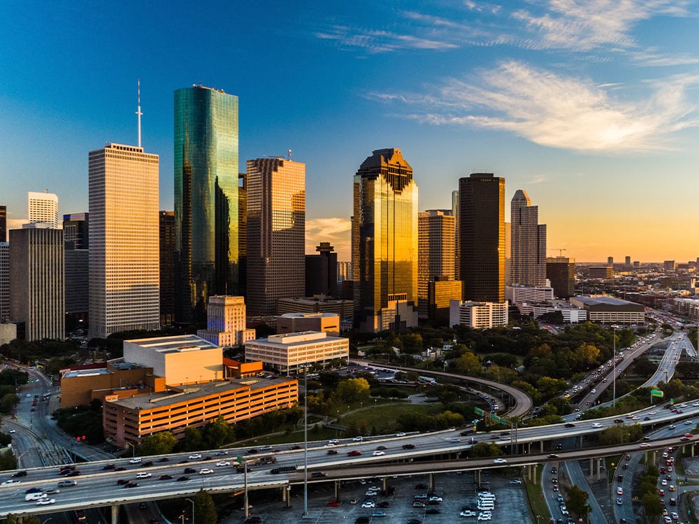 a body of water with a city in the background
